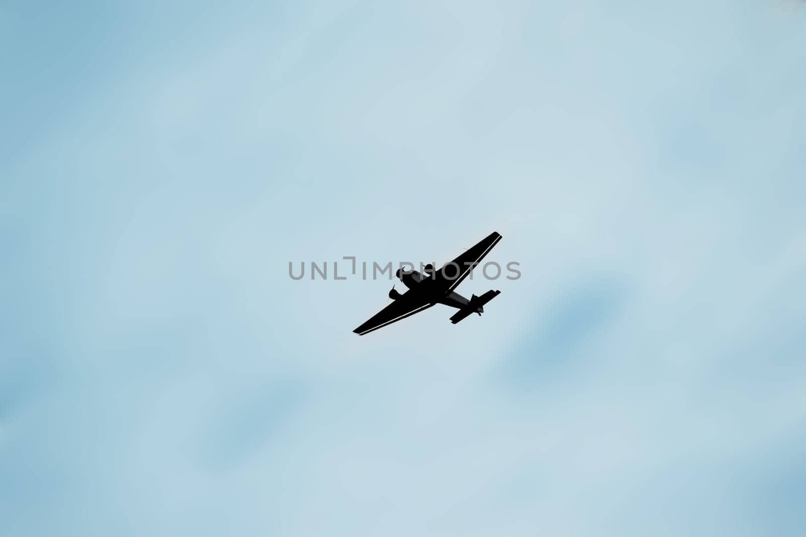 The Junkers Ju 52 a three-engine aircraft against a blurred background.