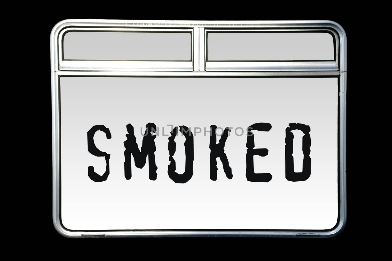 An abstract metallic shiny train window with the inscription Smoked.