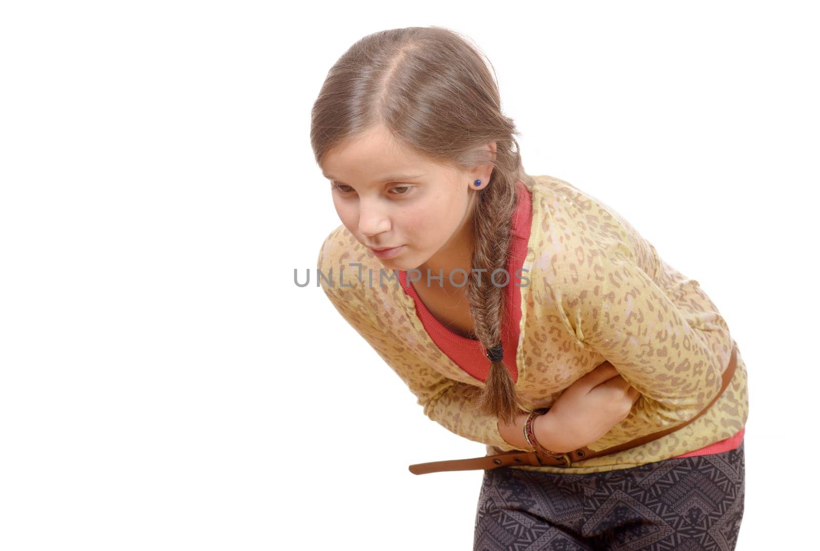 young girl with stomach ache, pain folded isolated on white background