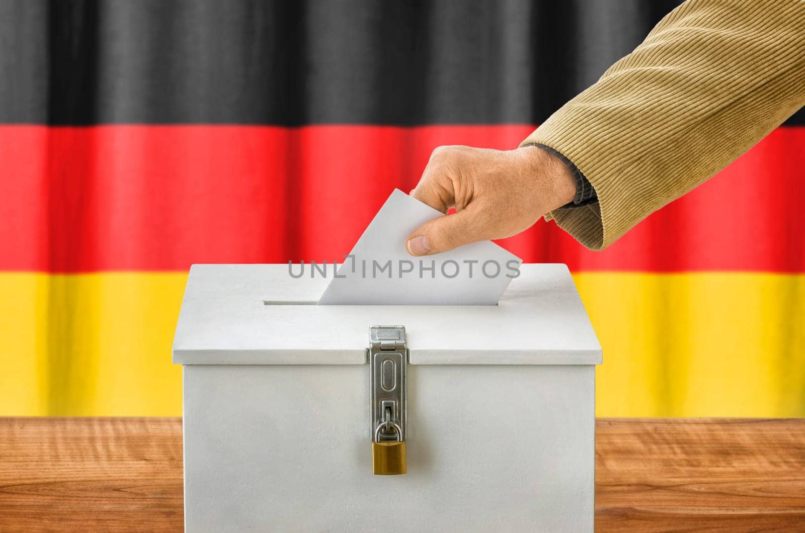 Man throws ballot papers into ballot box - Germany