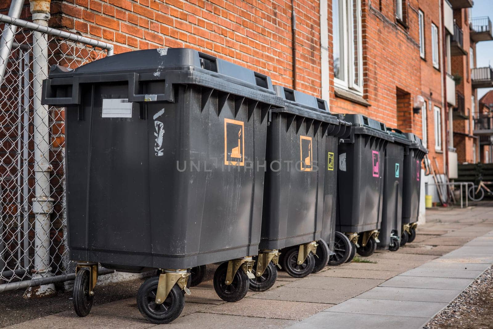 Garbage cans for waste sorting outside a house