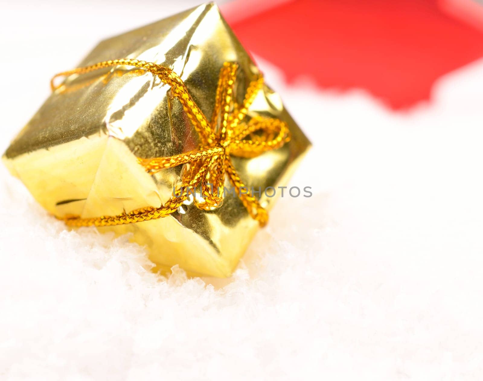 Christmas present in snow with space for text or image