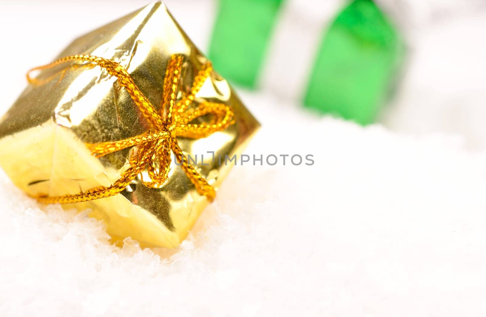 Christmas present in snow with space for text or image