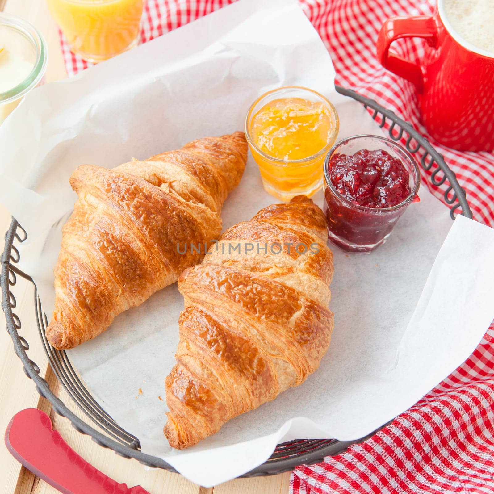Fresh croissants with jams for breakfast
