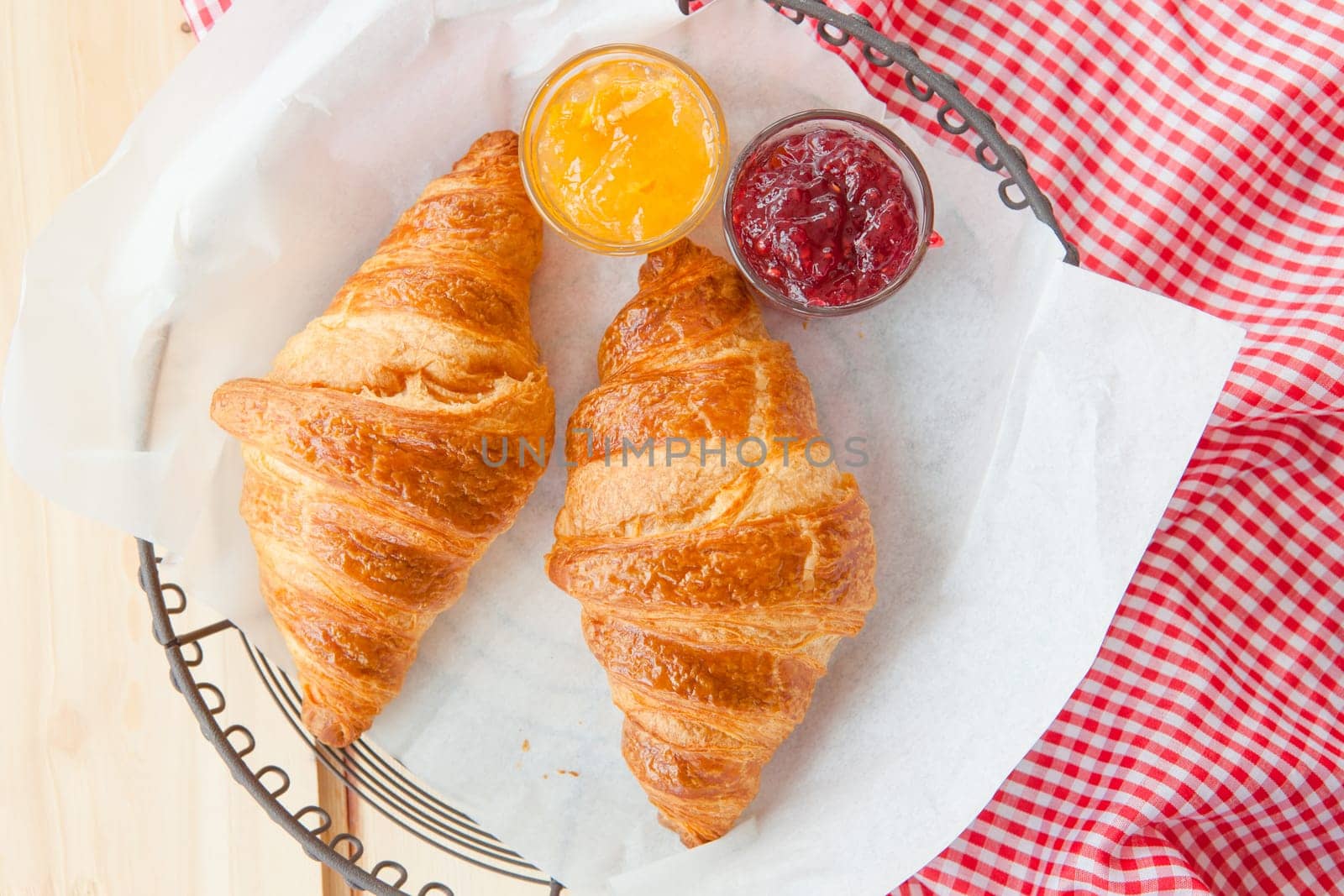 Fresh croissants with jams for breakfast