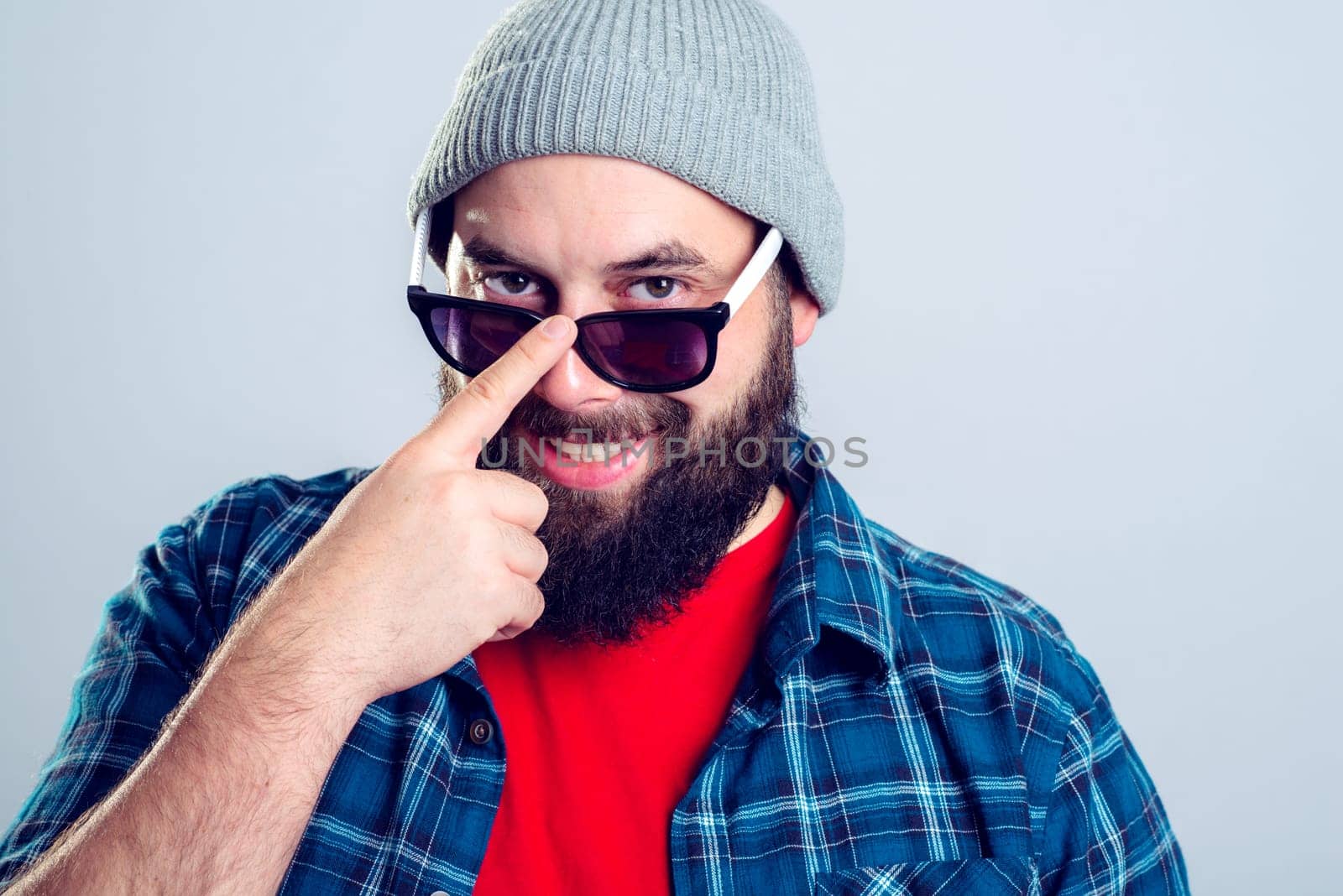 young bearded man looking friendly in to the camera