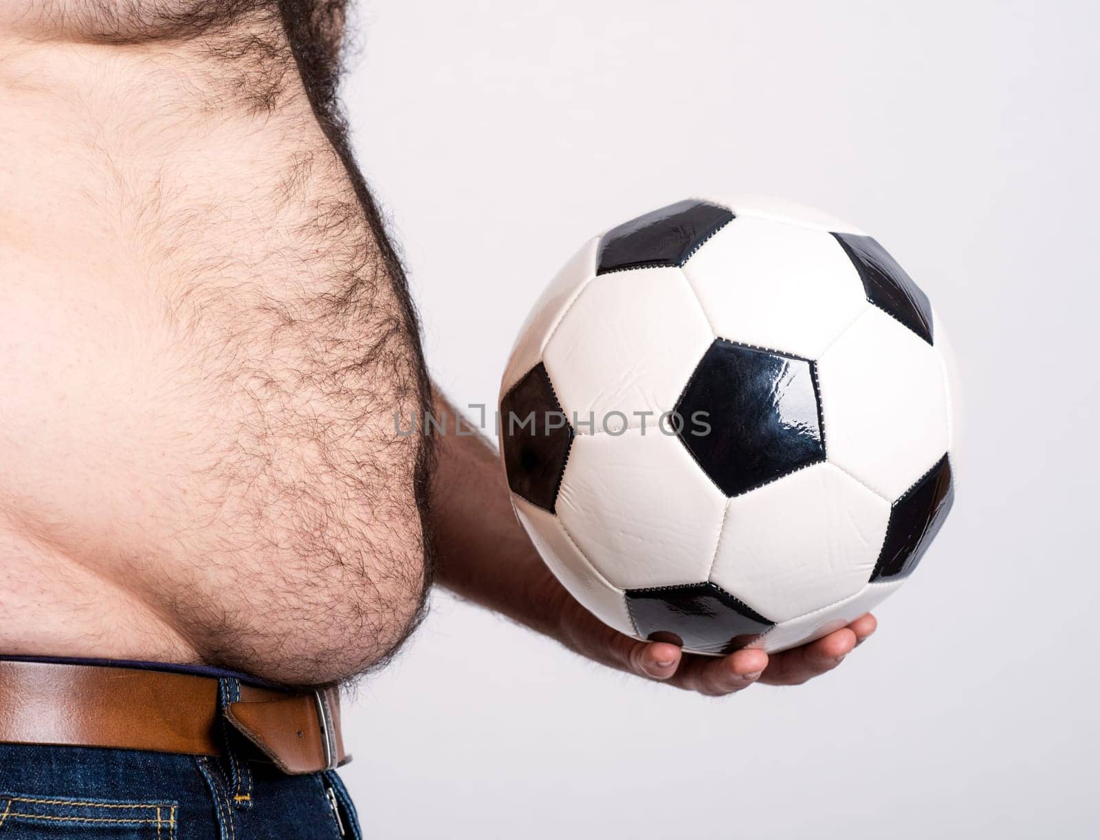portly belly of a man with black and white football
