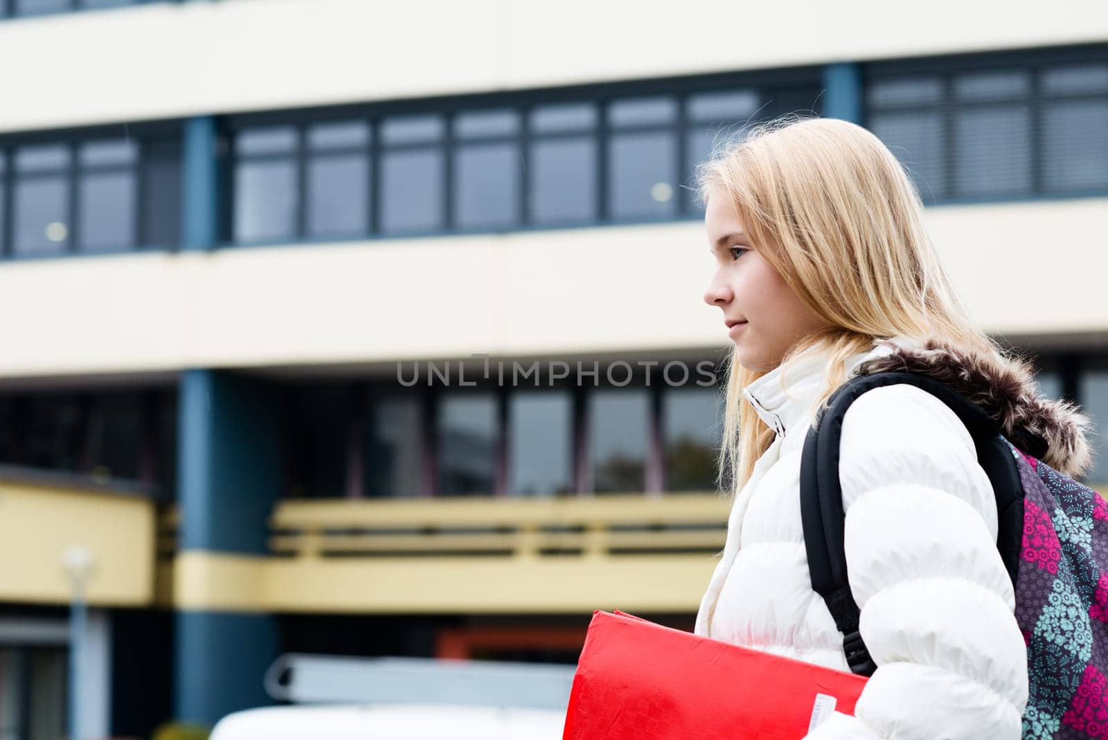 nice blond girl in front of school building