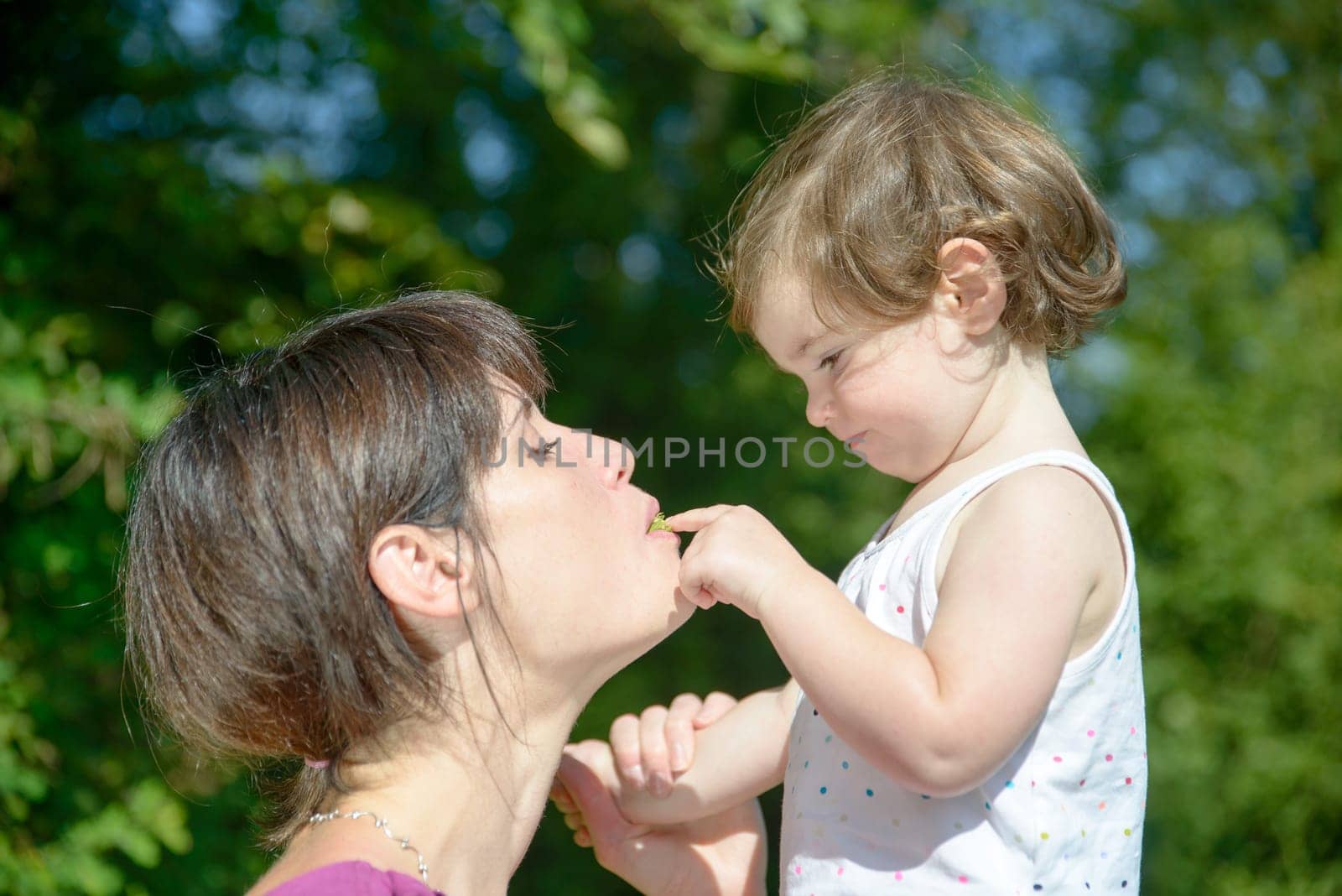 a beautiful mother and daughter playing together