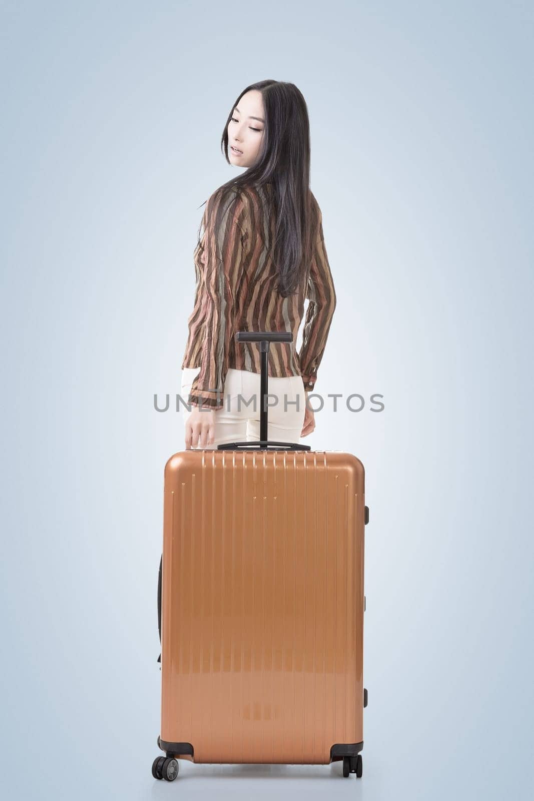 Modern Asian woman stand with a luggage.