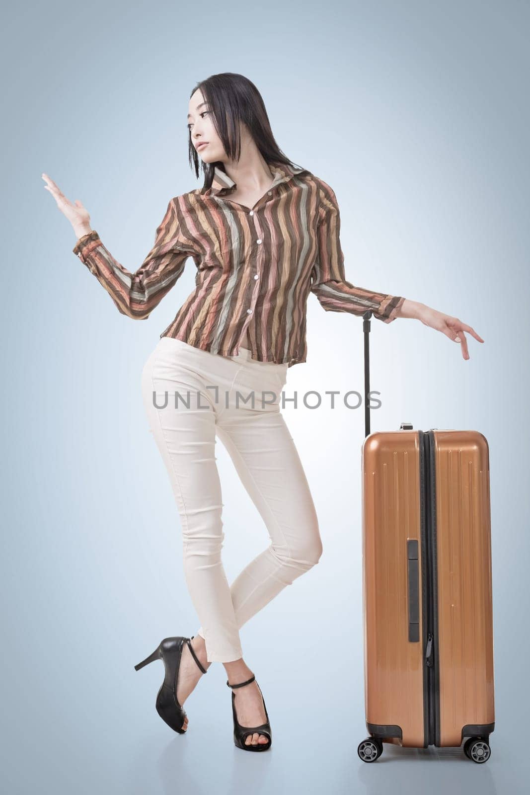Modern Asian woman stand with a luggage in vintage style.