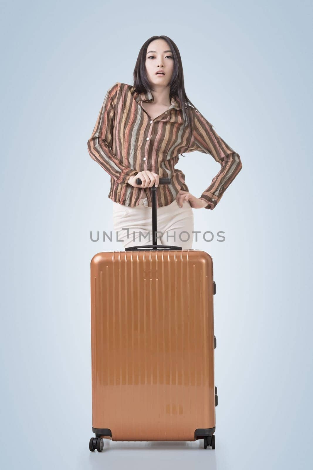 Modern Asian woman stand with a luggage.