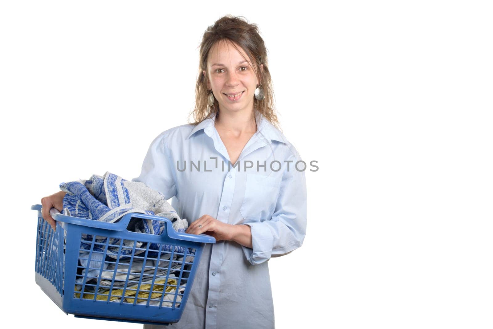 young woman with a laundry basket for ironing