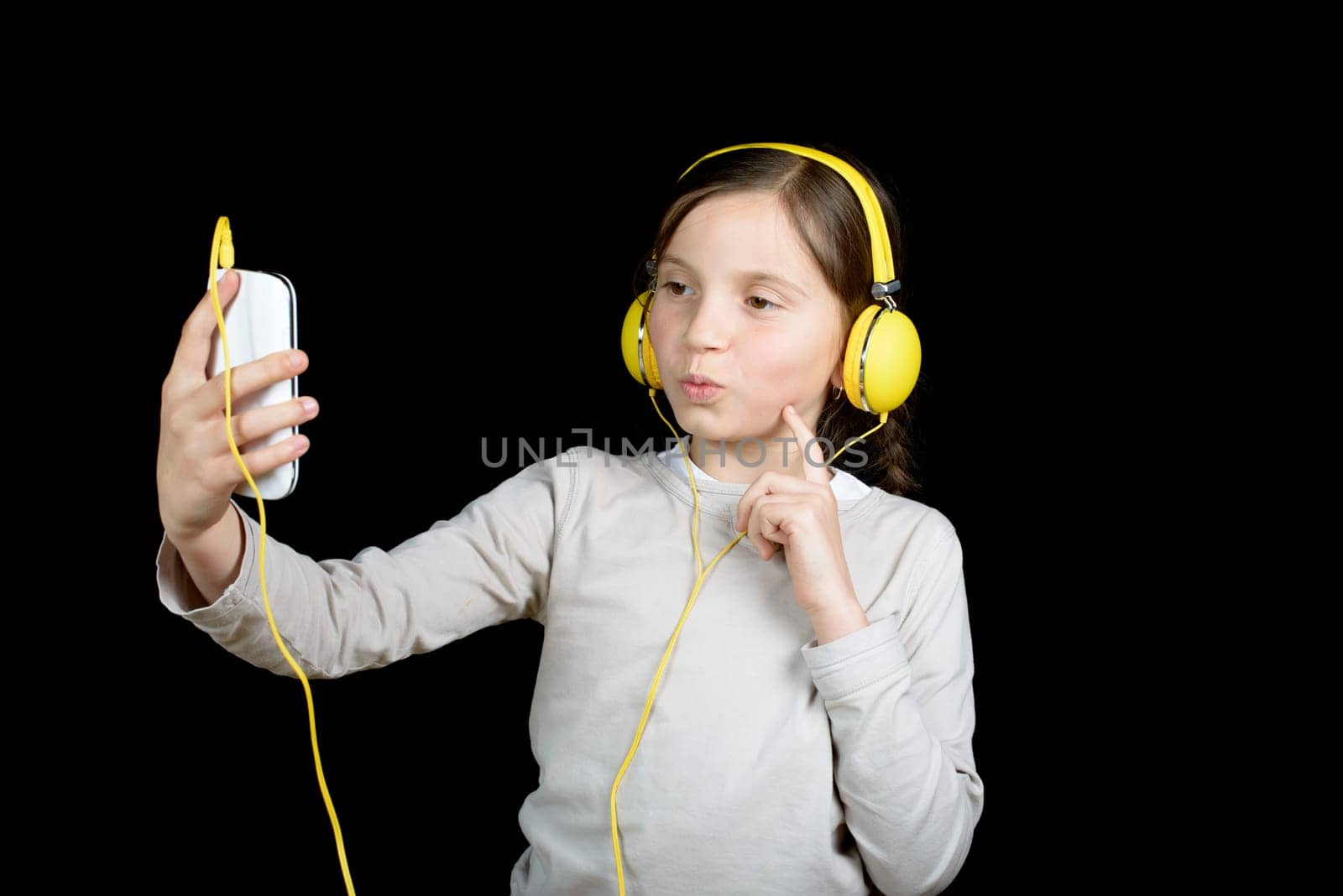 a beautiful young girl listening to music with a walkman