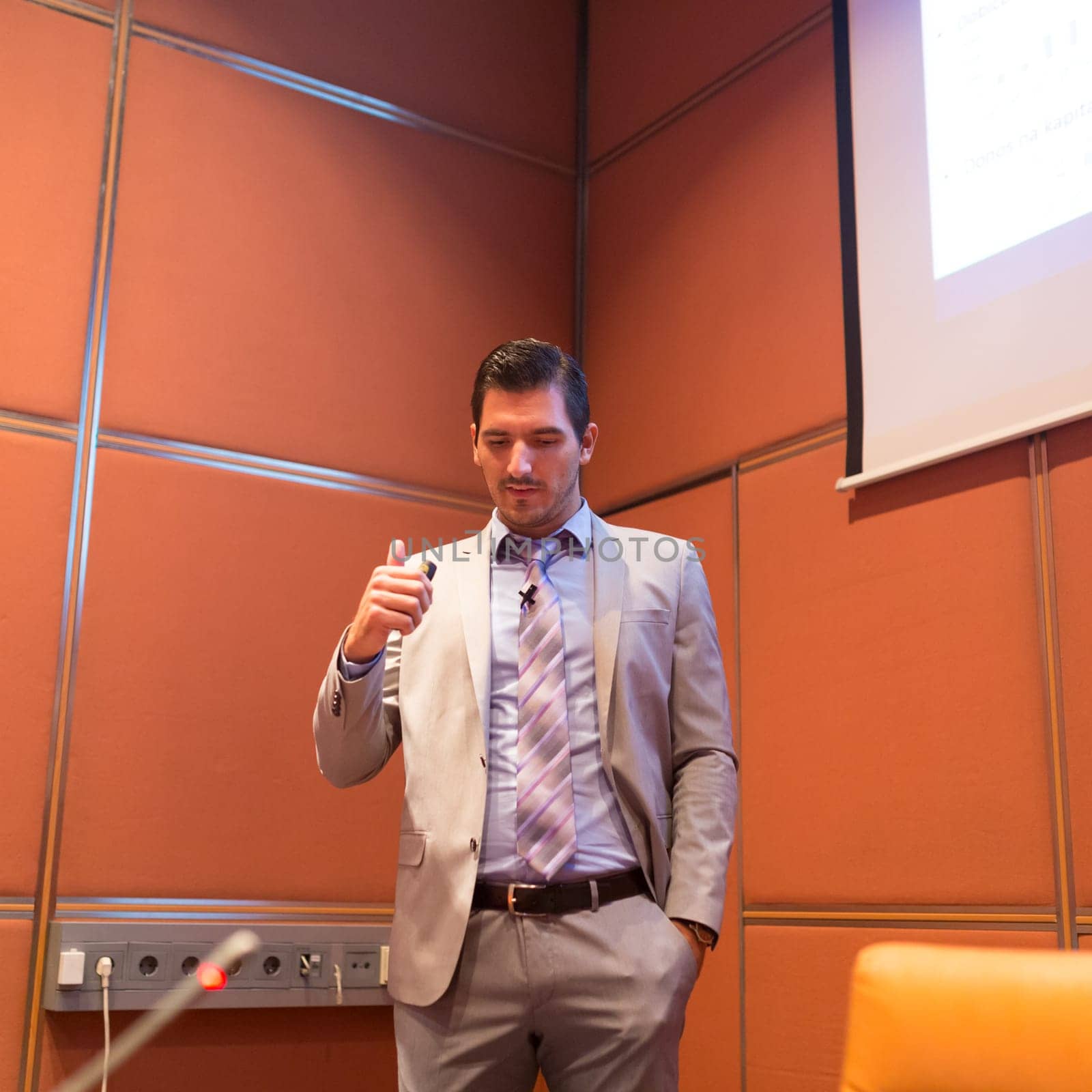 Speaker giving talk on podium at Business Conference. Entrepreneurship club. Square compozition.
