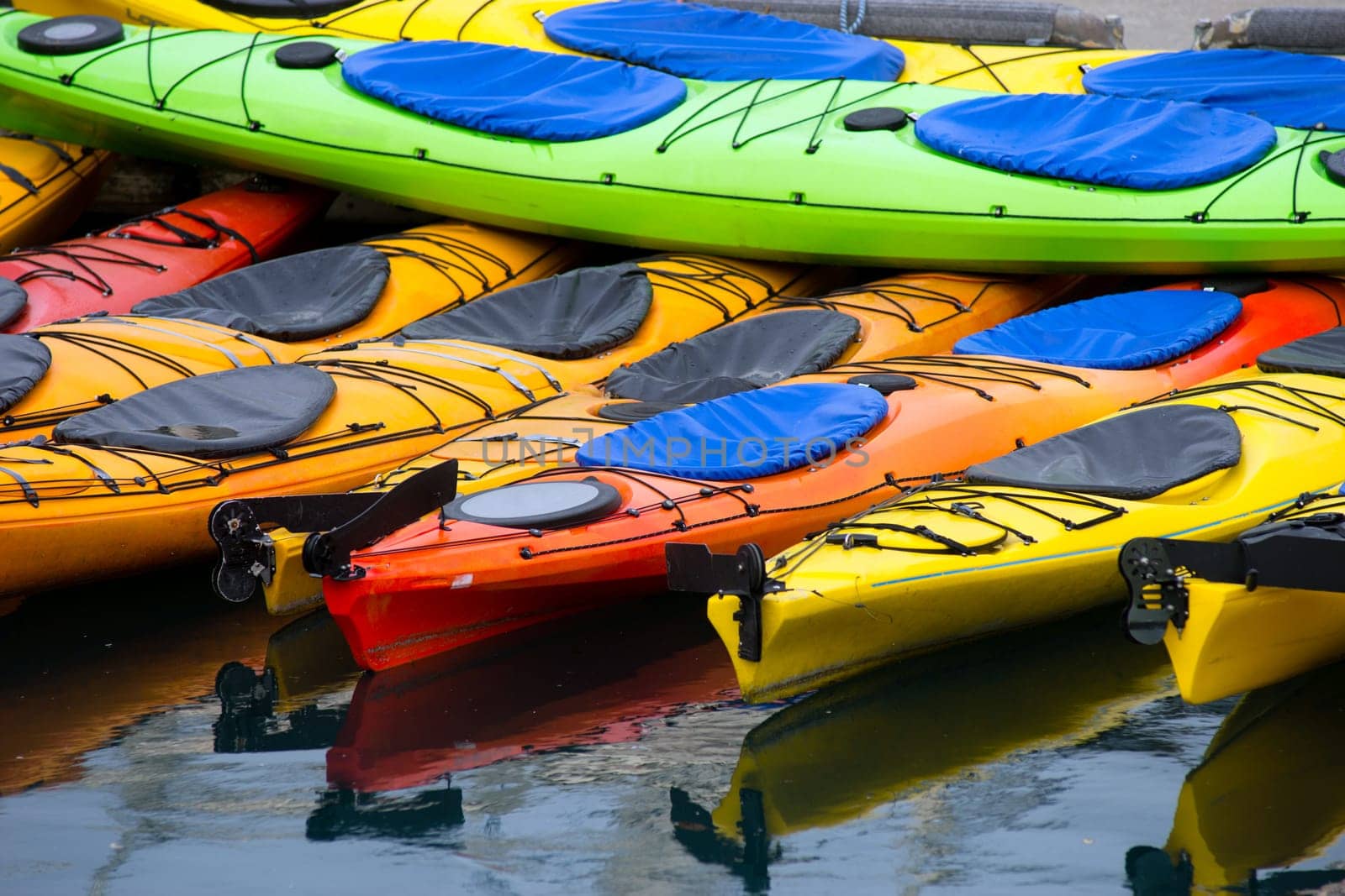 Kayaks wait for the next traveler to pay for a rental