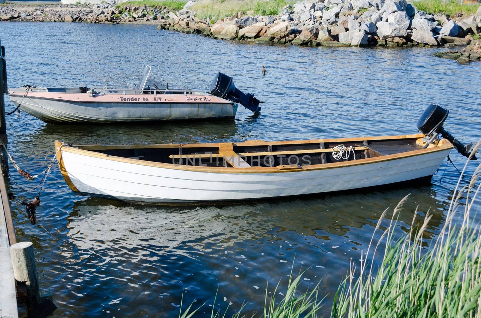 old boat in the water with one old engine back