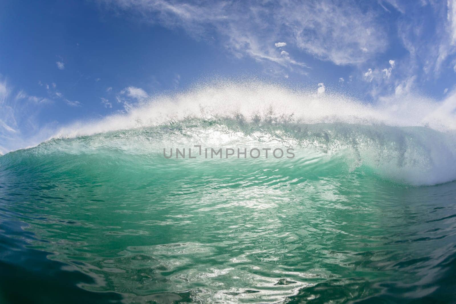 Wave crashing hollow face to face swimming ocean encounter.