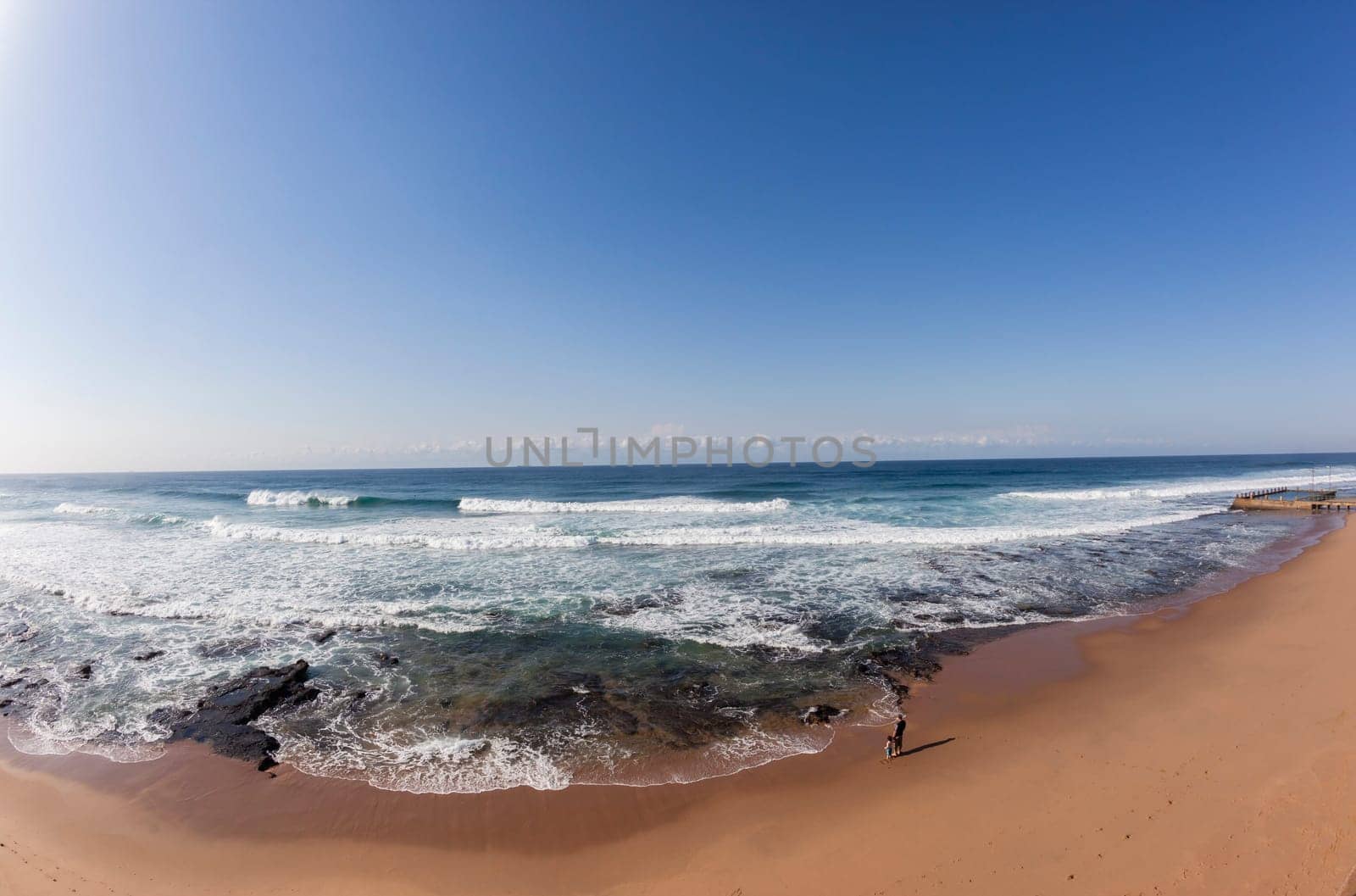 Family father mother child and young Son experience beach wave water ocean landscape