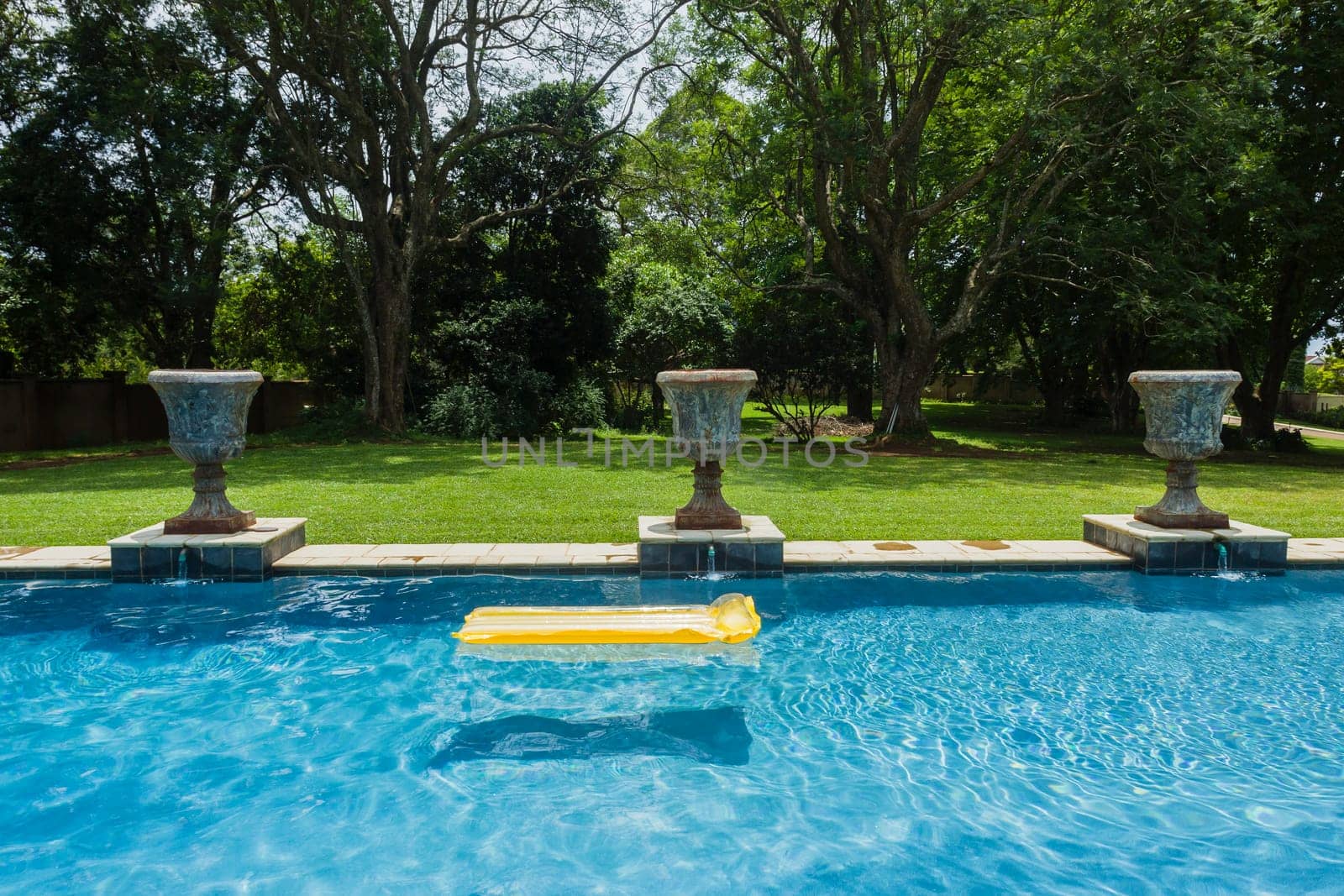Swimming pool blue water yellow air matt sunbath home private solitude.