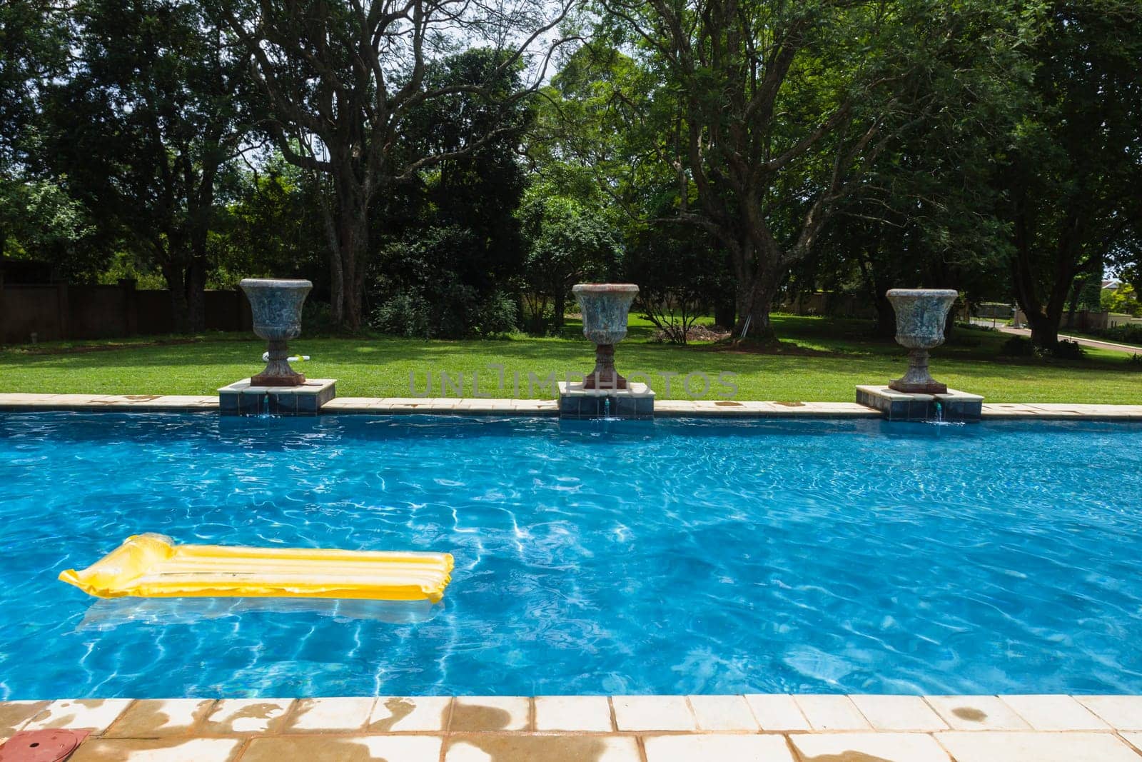 Swimming pool blue water yellow air matt sunbath home private solitude.