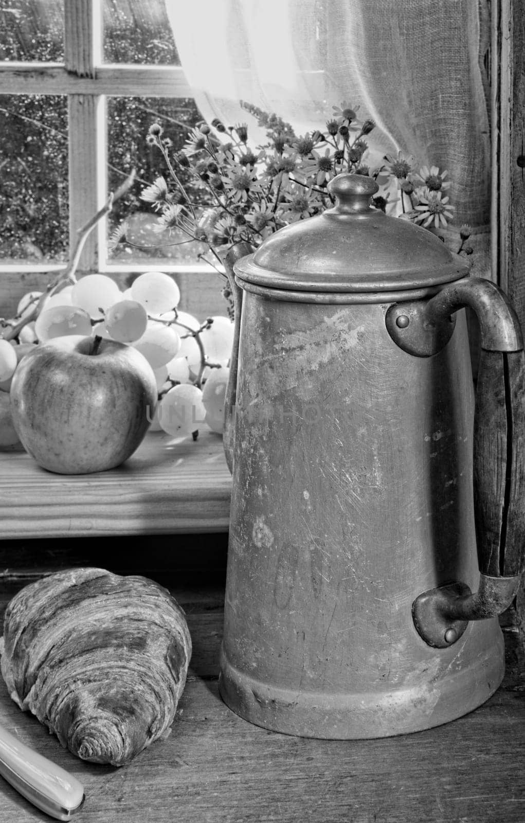 old coffee maker in black in white with breakfast
