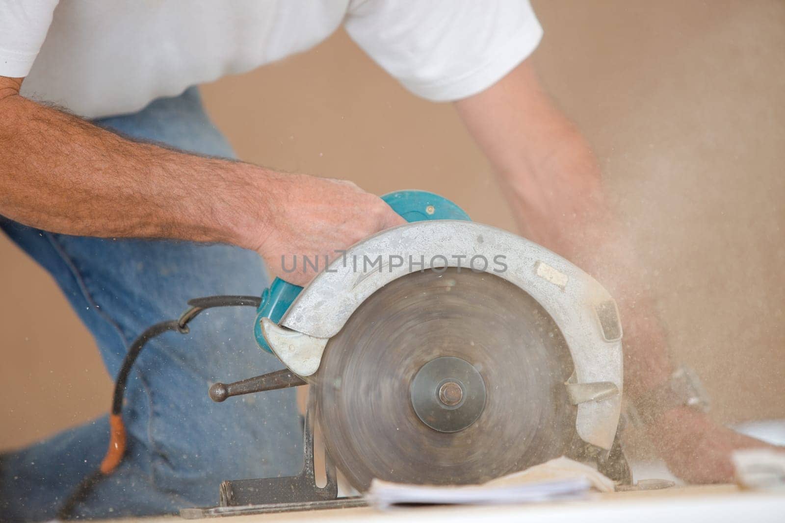 Carpenter using a circular saw