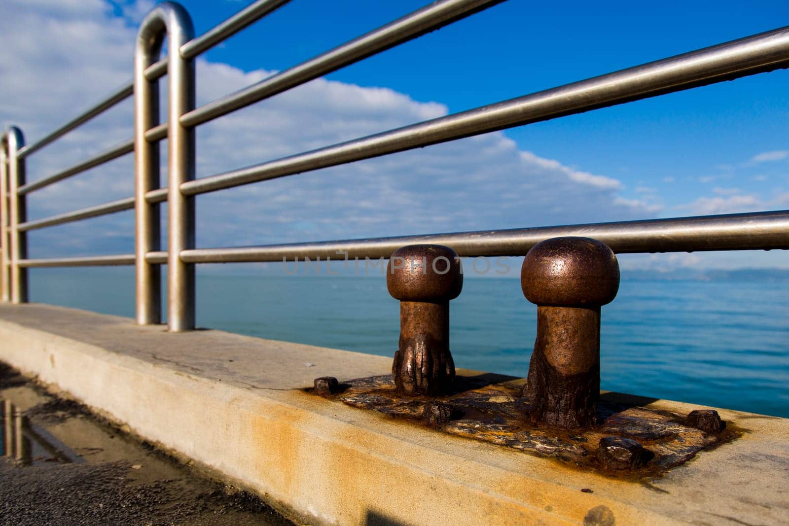 View of two old cleats of a pier marine eroded by salt