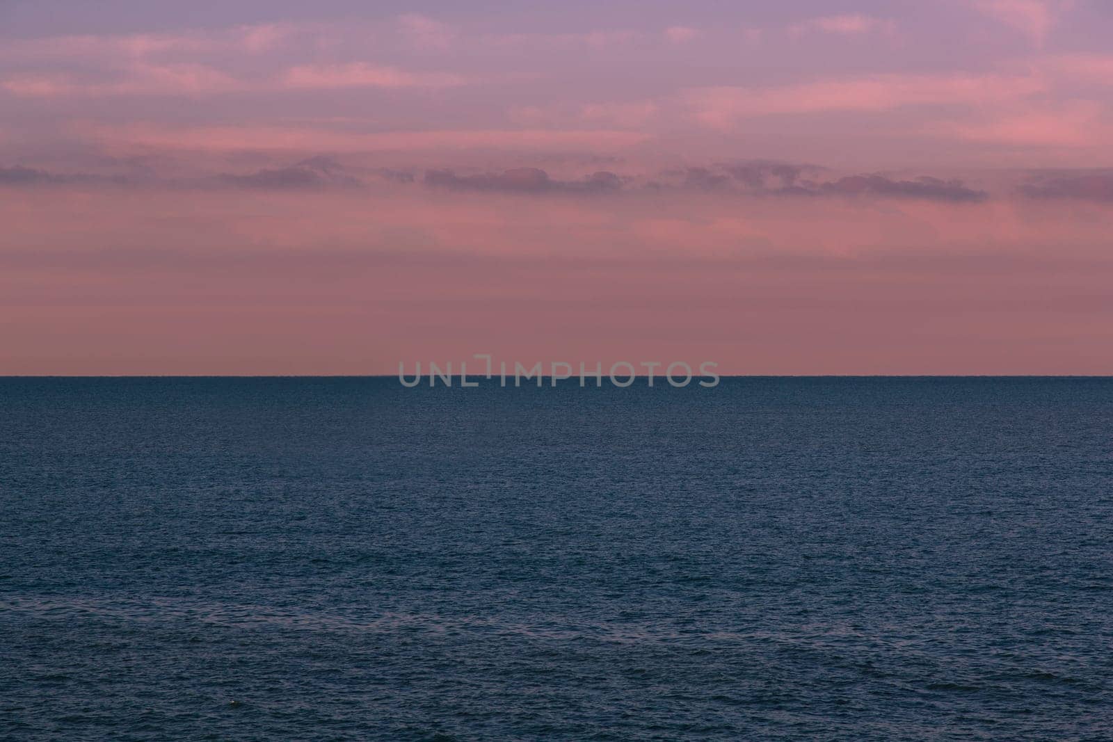 Seascape with a merchant ship in the background