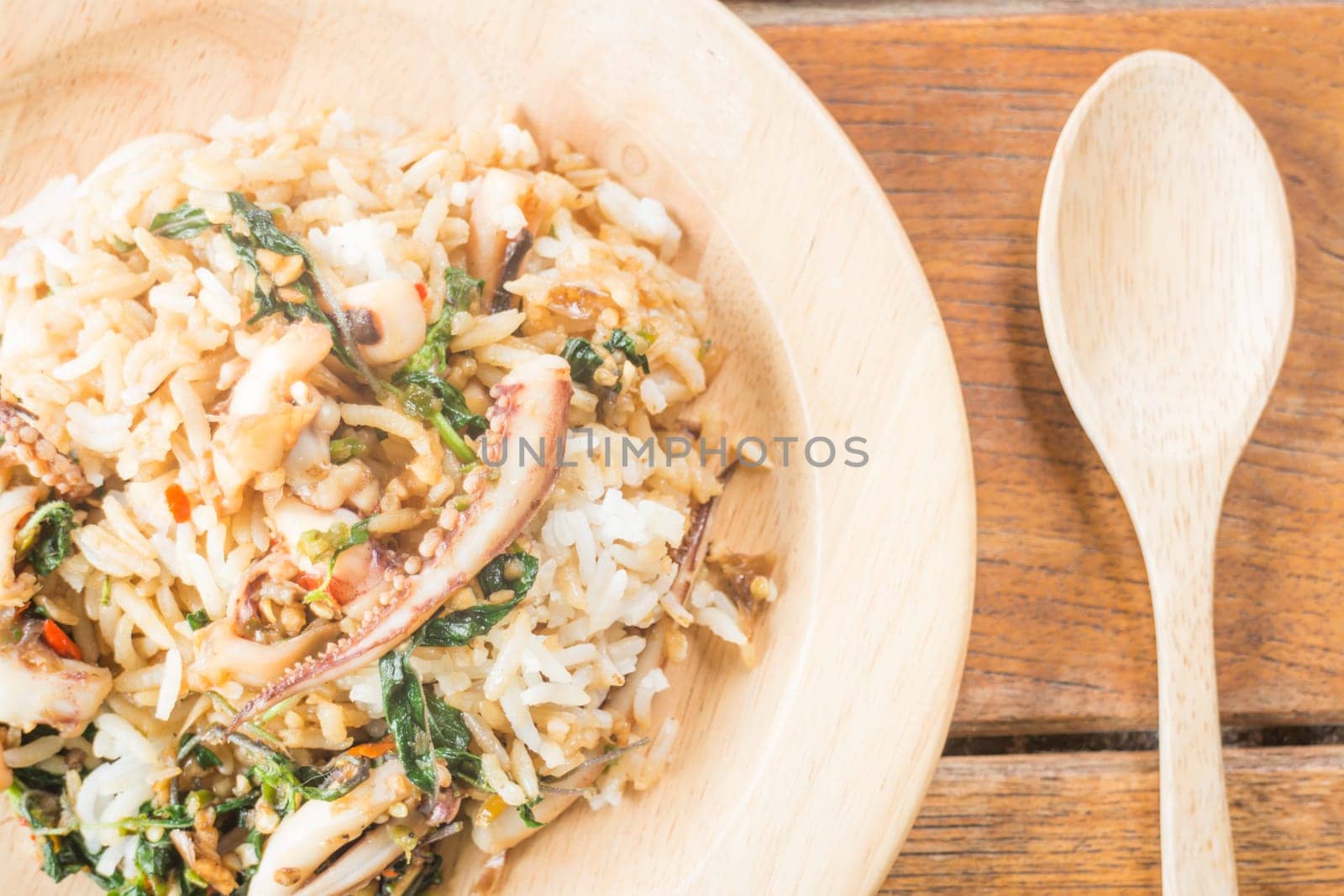 Rice topped with stir-fried squid basil (Thai food), stock photo