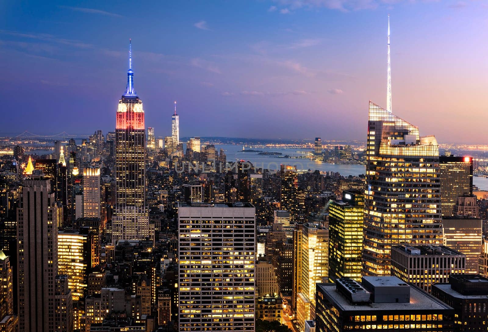 New York City skyline with urban skyscrapers at sunset, USA.