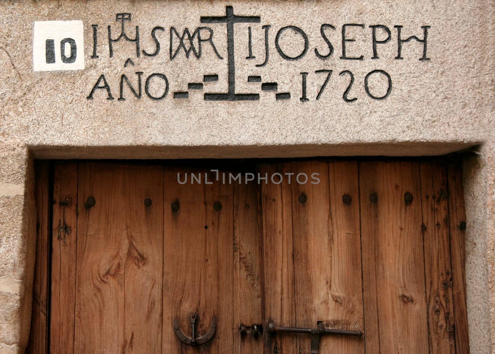 Jewish neighborhood door with inscriptions over the door, Caceres, Spain
