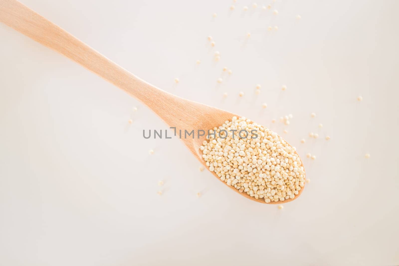 Raw organic white quinoa seeds, stock photo
