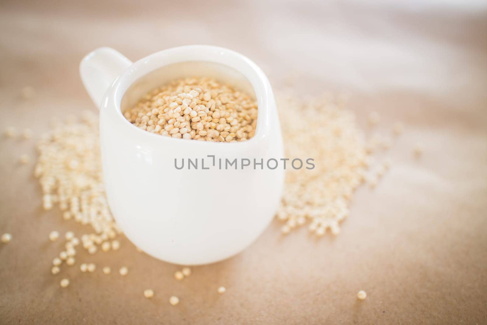 Raw organic white quinoa seeds, stock photo
