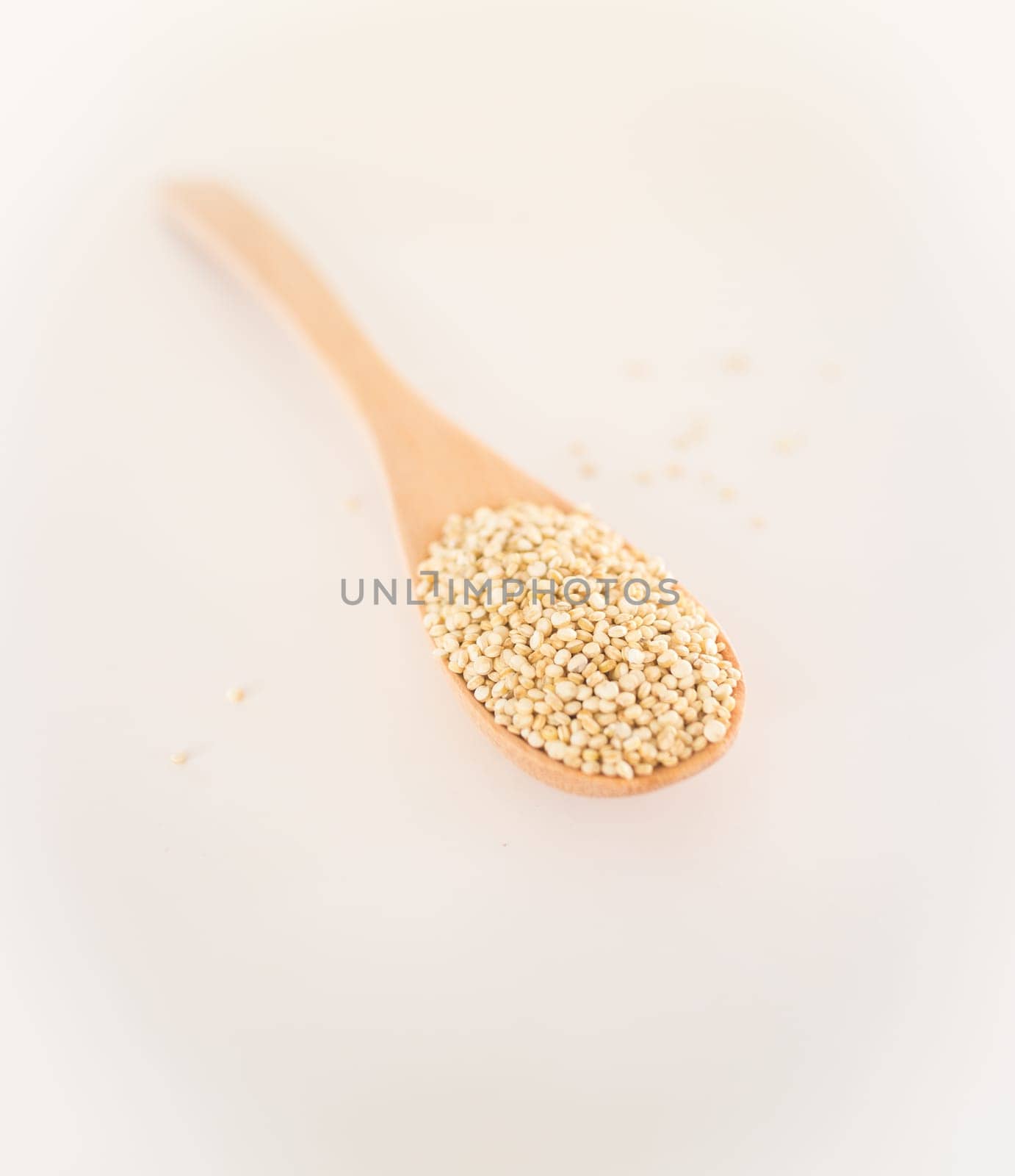 Raw organic white quinoa seeds, stock photo