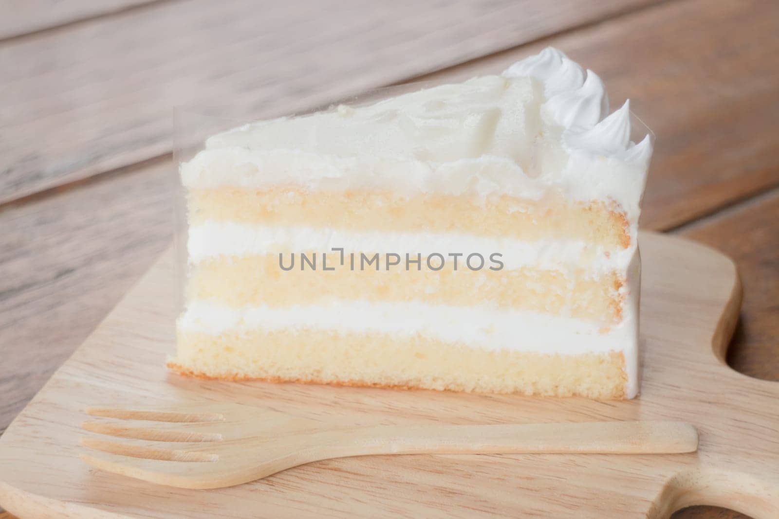Coconut sponge cake with whipped cream, stock photo