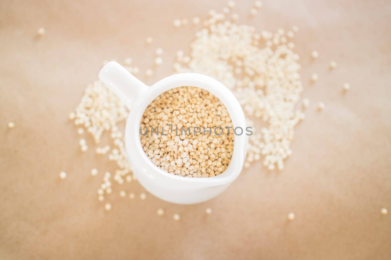 Raw organic white quinoa seeds, stock photo