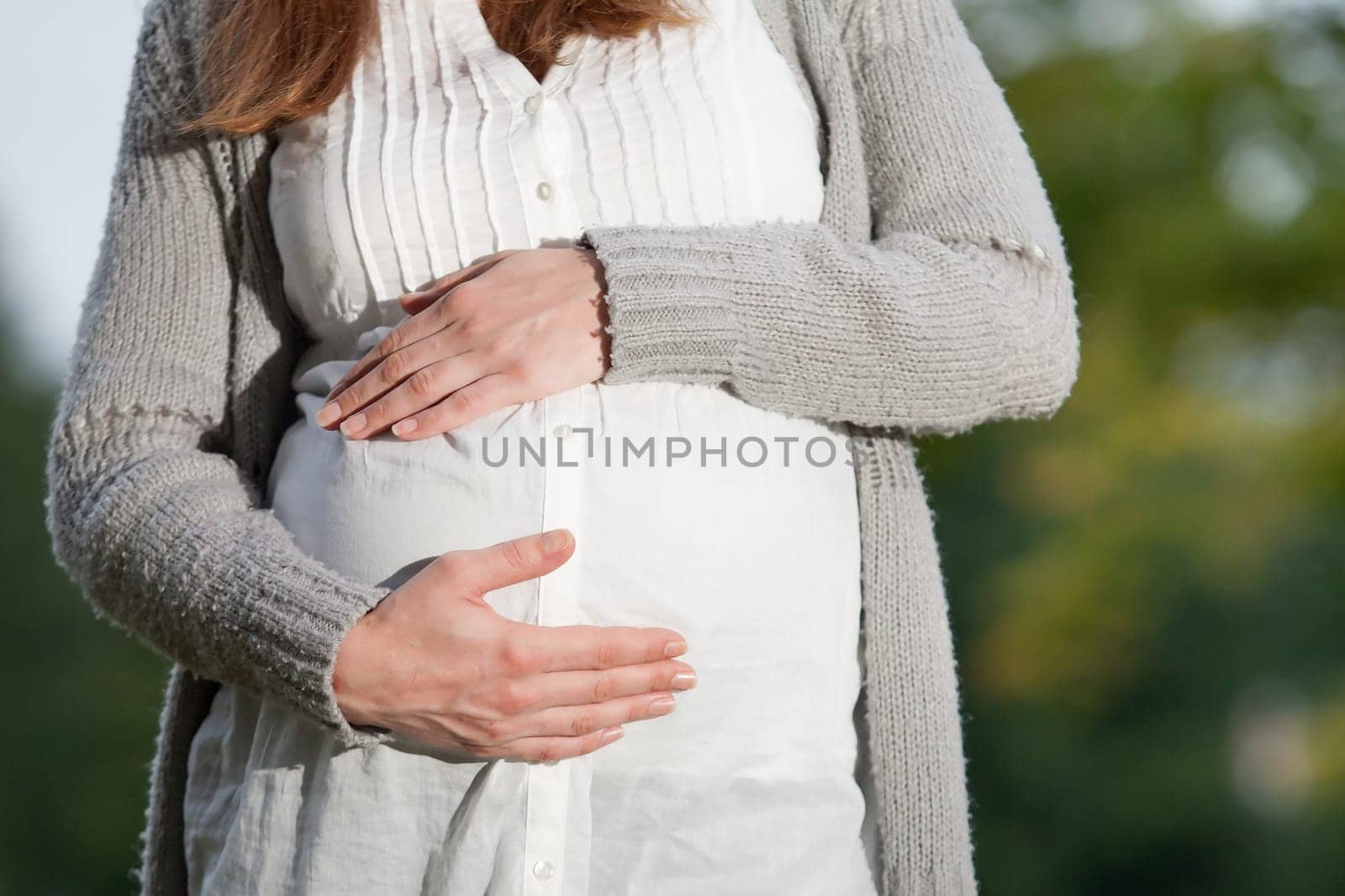 Young new mother is having fun outside
