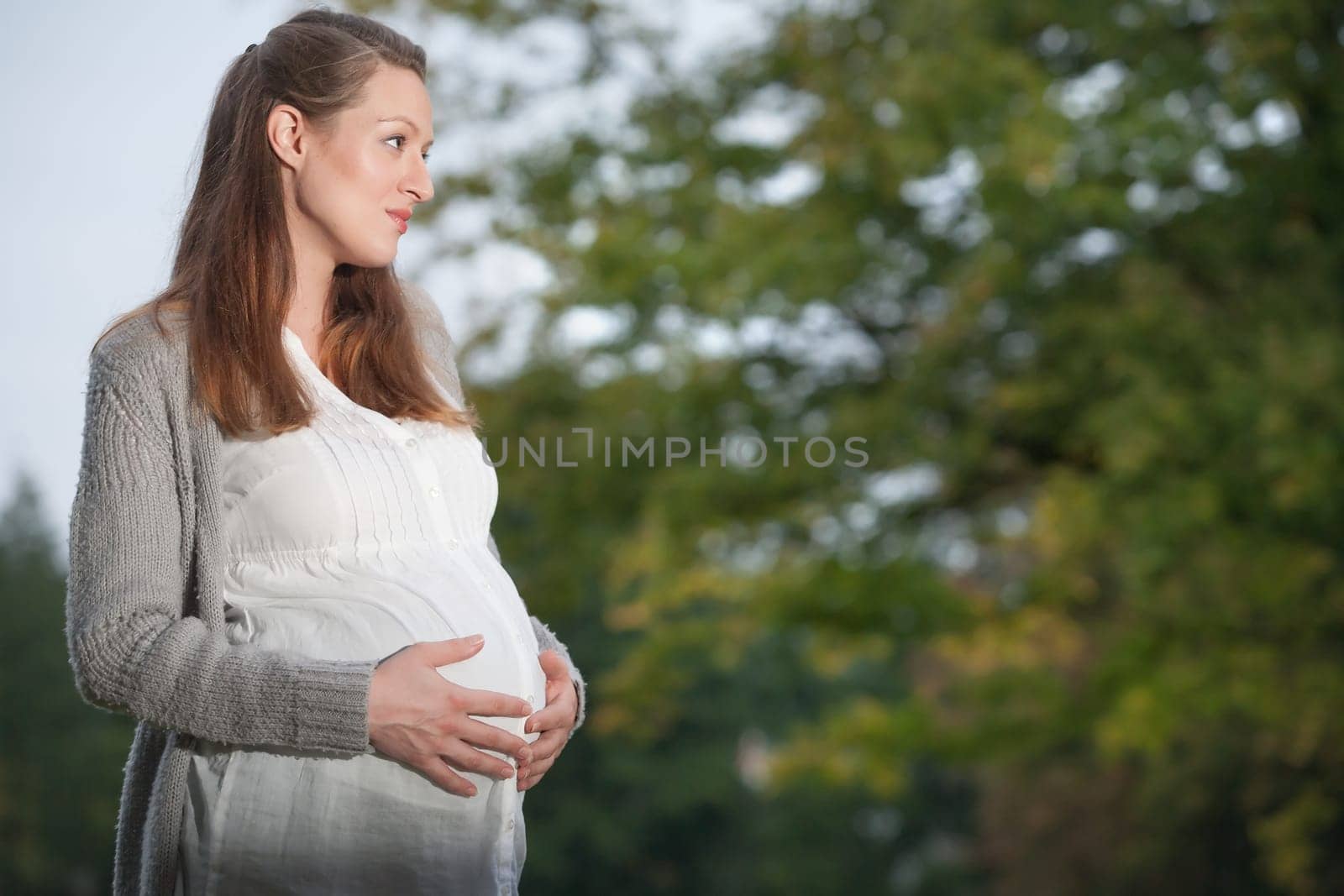Young new mother is having fun outside