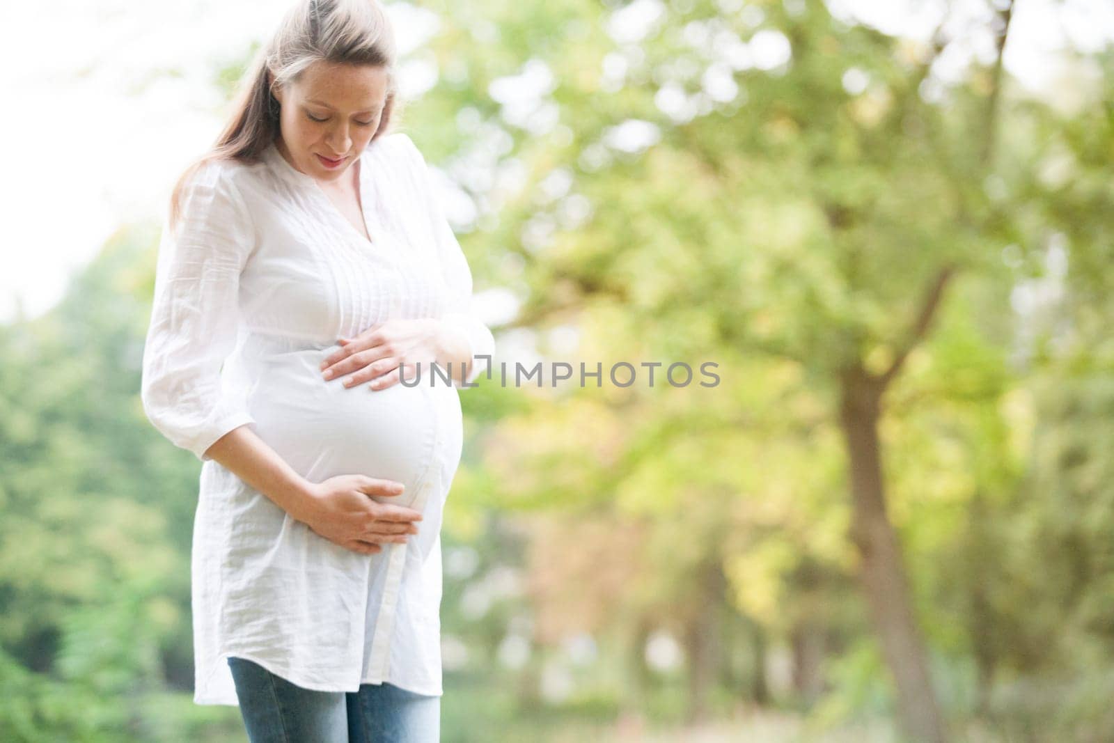 Young new mother is having fun outside