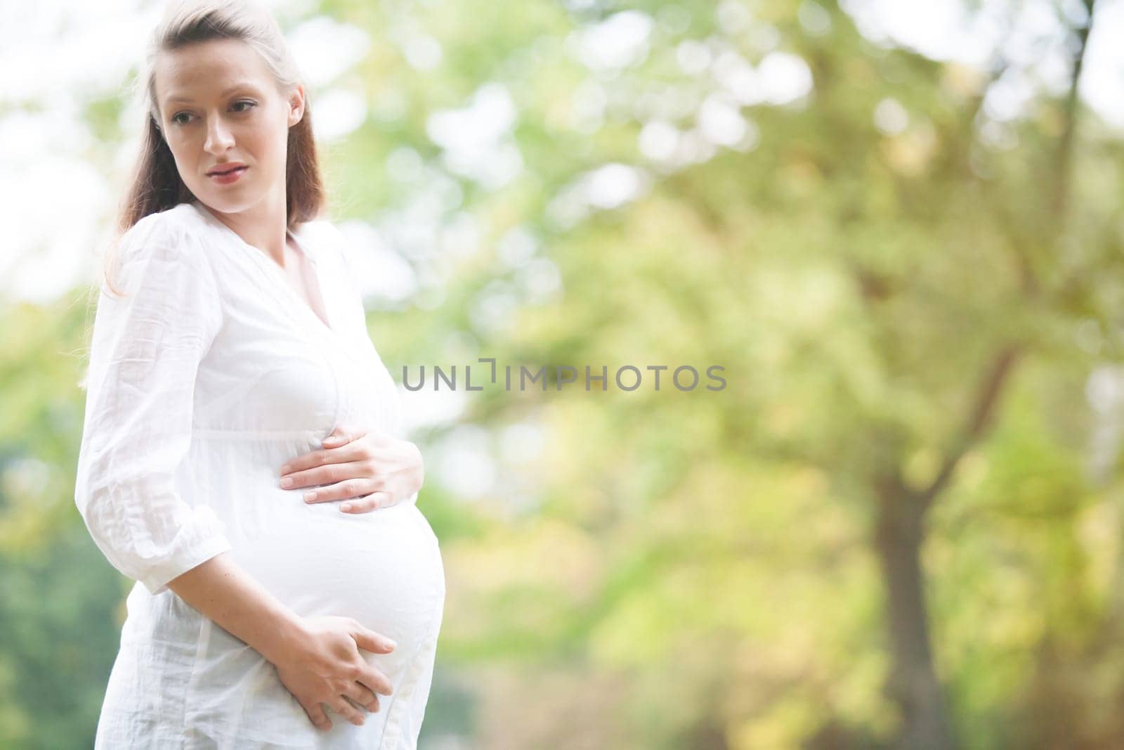 Young new mother is having fun outside