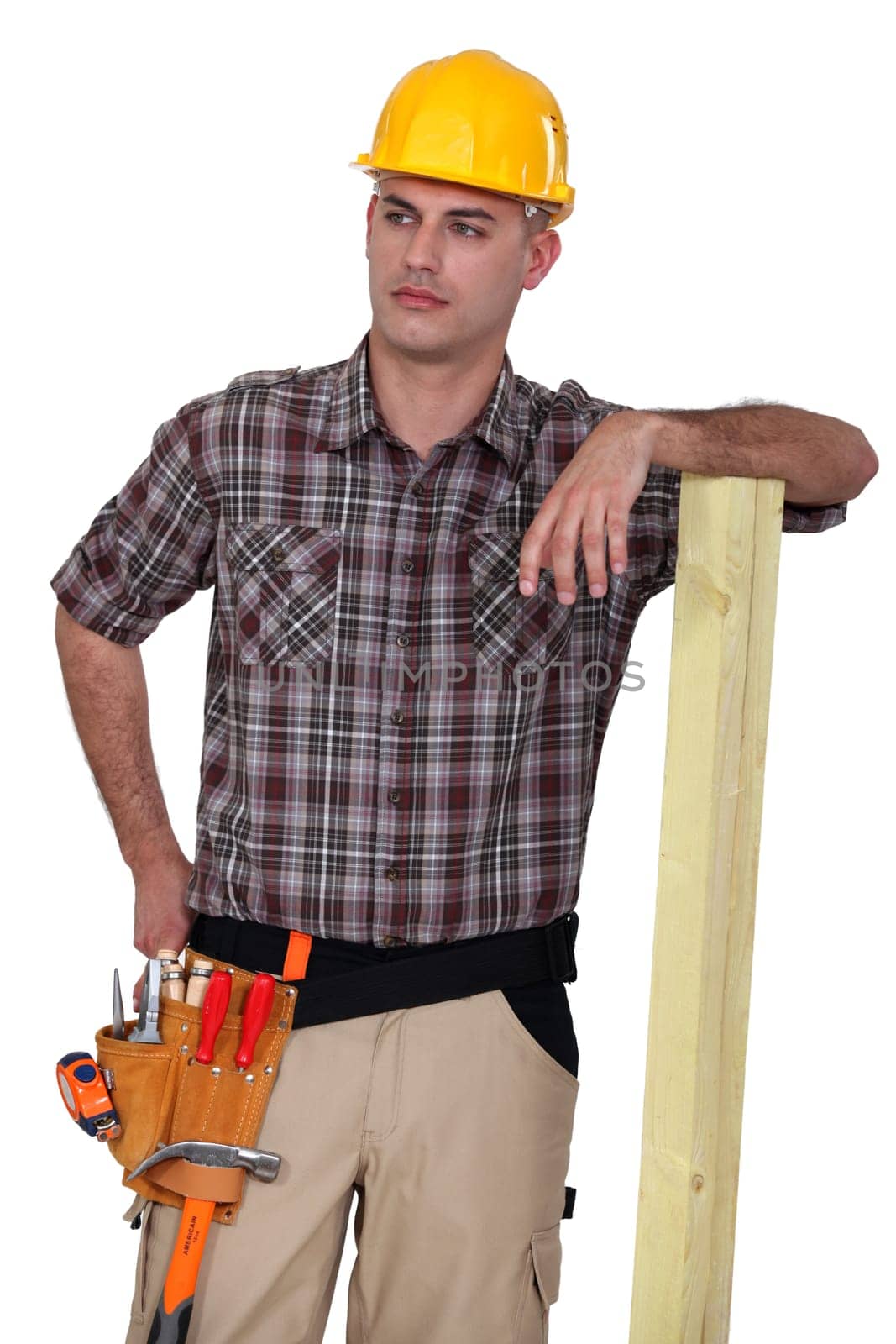 Worker resting on plank of wood