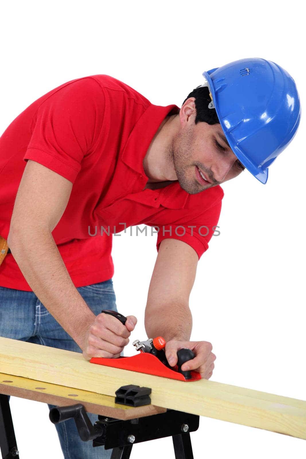 Construction worker planing wood