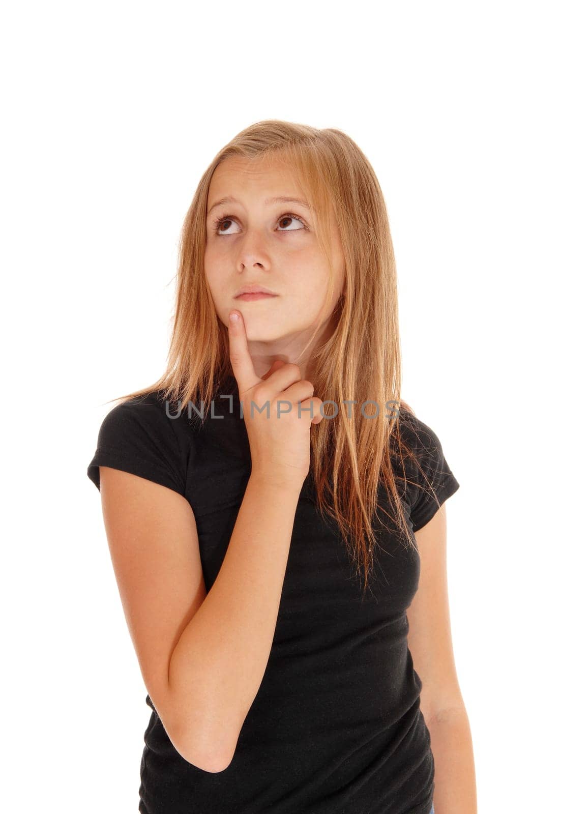 A pretty blond slim girl holding her finger on her chin, looking.upwards, isolated for white background..