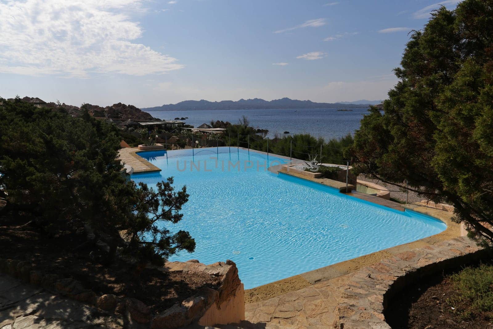 Swimming pool with view on the coast in Sardinia