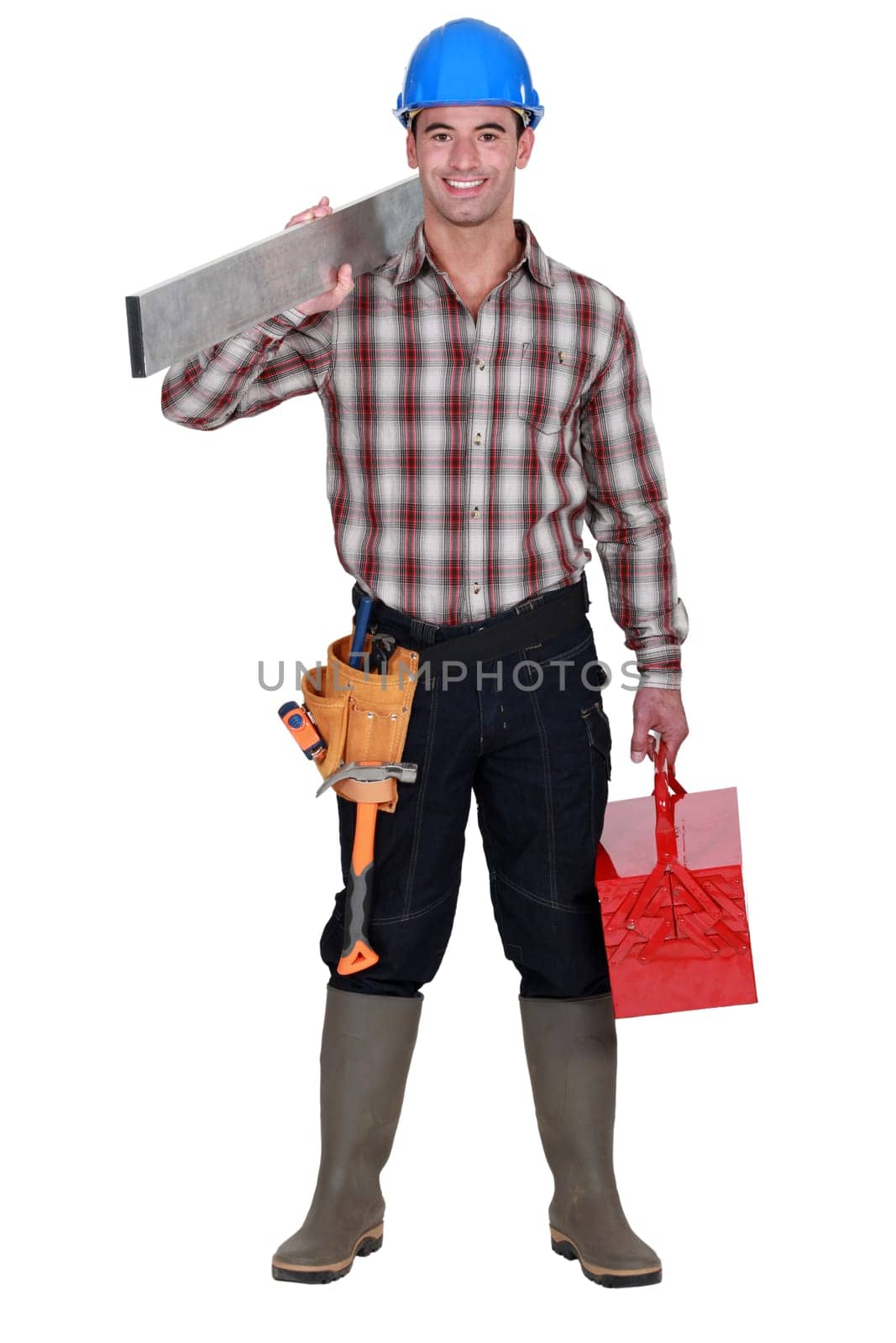 Worker carrying an aluminium plank and a toolbox