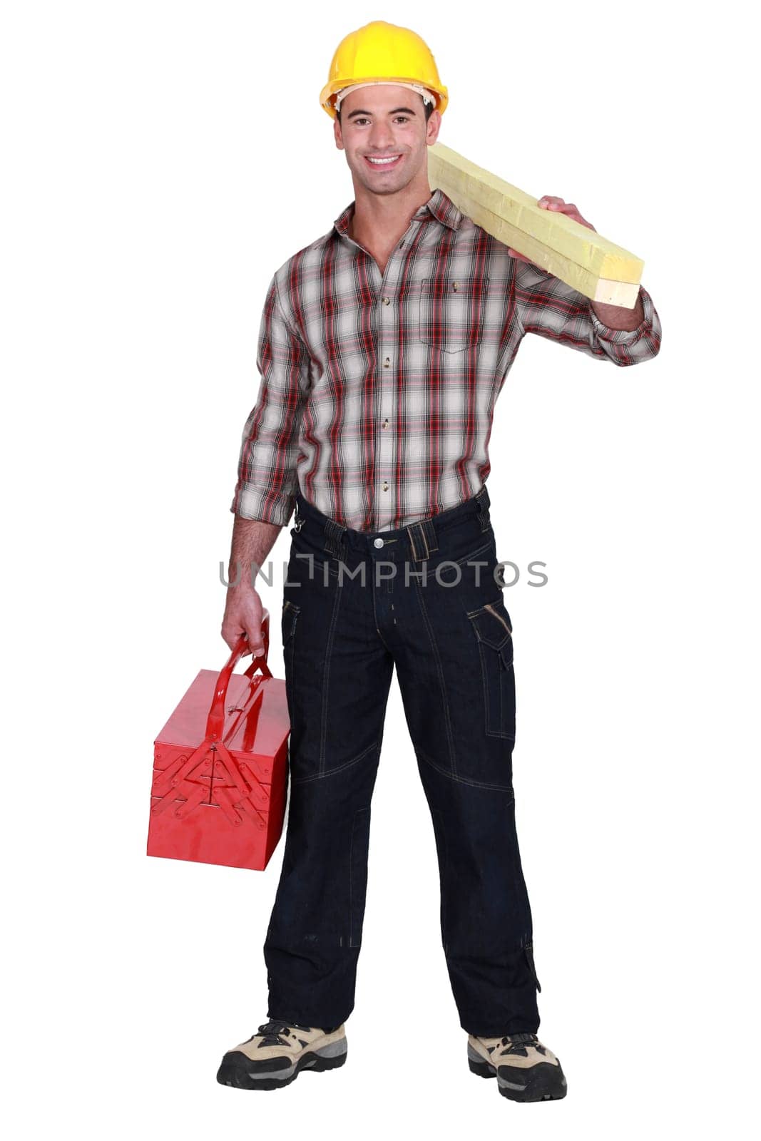 craftsman holding a board and a tool box