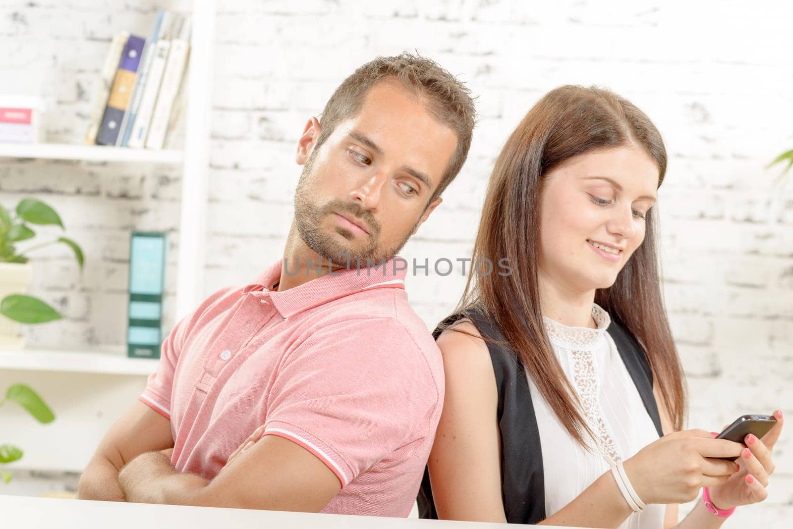 a young couple with problems, woman phone