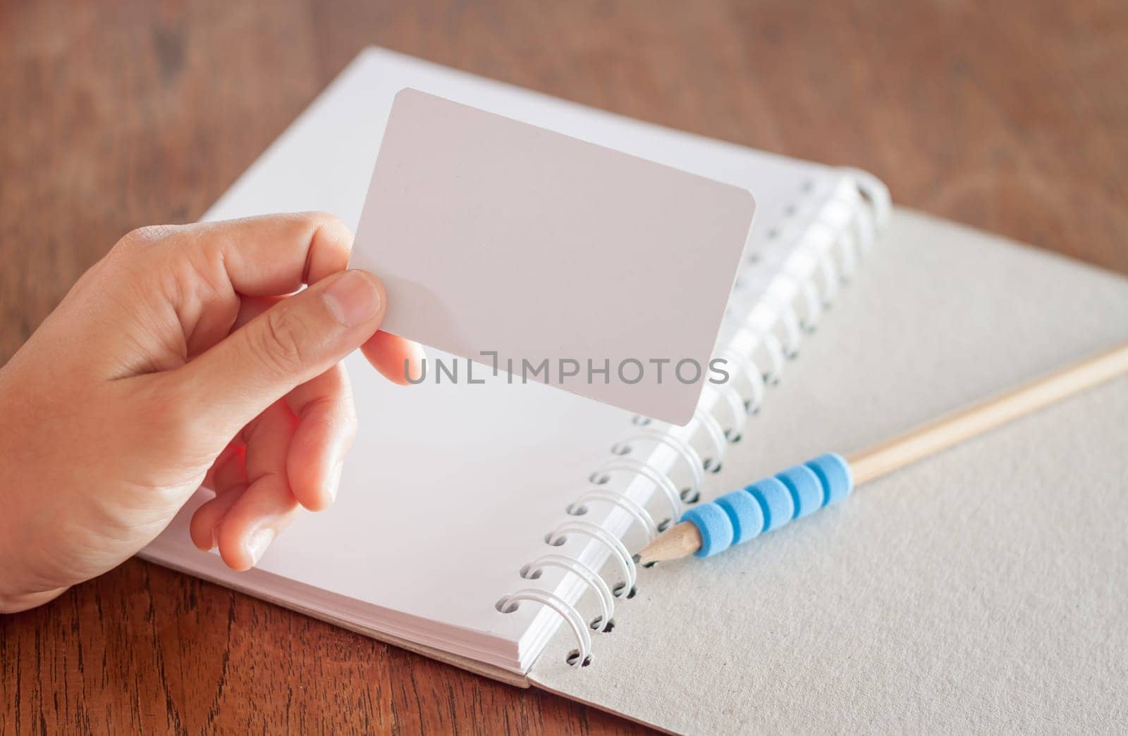 Woman hold blank business cards, stock photo