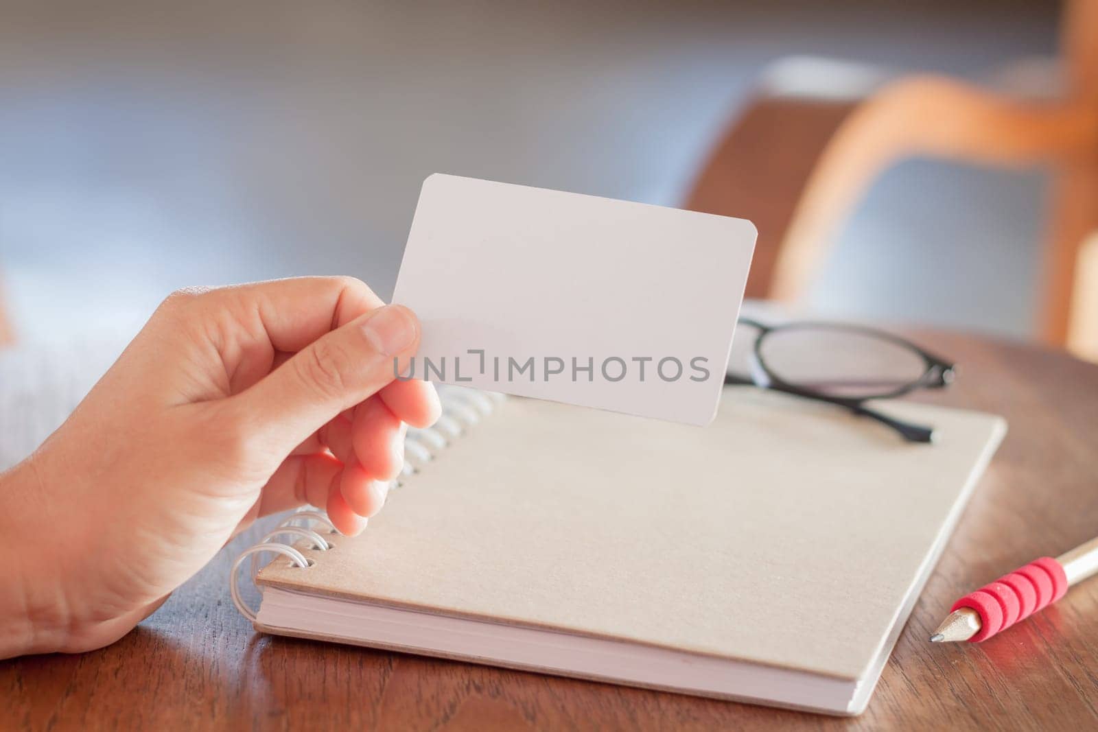 Woman hold blank business cards, stock photo